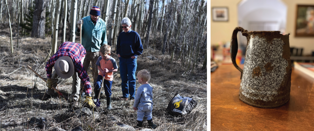 A group of four adults and two children are gathered in an aspen forest, with one adult digging in the ground while the others observe.